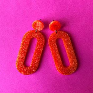 Glittery Orange Oval Earrings